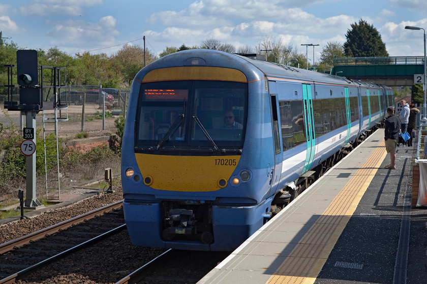 170205, LE 11.20 Ipswich-Cambridge (2W12, 2E), Kennett Station 
 170205 arrives at Kennett station working the 11.20 Ipswich to Cambridge. Kennett station has gone through a number of recent changes that have improved its facilities for example, a new footbridge, new platform services and shelters. In 2011, it lost its signal box and associated signalling, the box being located at the far end of the platform I am standing on here. This was one of the boxes that 'got away' even though it was relatively local to me and one that I passed several times on the adjacent A14 road. 
 Keywords: 170205 2W12 Kennett Station