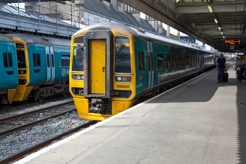 158820, AW 11.27 Holyhead-Birmingham International (1G40) & 158823, 13.08 Birmingham International-Holyhead (1D14), Shrewsbury station 
 158820 comes to a halt at Shrewsbury forming the 1G40 11.27 Holyhead to Birmingham International. I took this train to the end of its journey as the first leg of my trip home. Behind it, 158823 and a classmate pause working the 13.08 Birmingham International to Holyhead. 
 Keywords: 158820 11.27 Holyhead-Birmingham International 1G40 158823 13.08 Birmingham International-Holyhead 1D14 Shrewsbury station