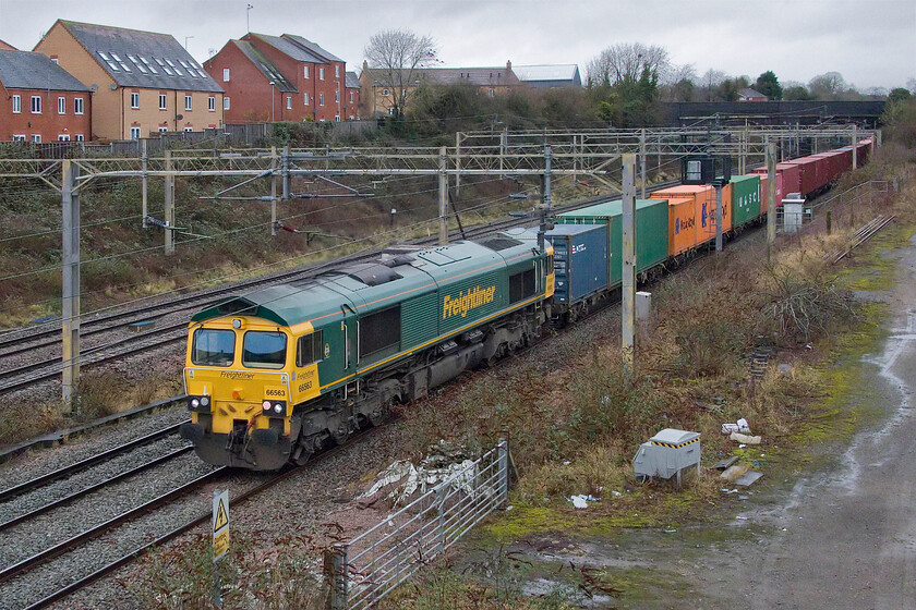 66563, 11.48 Lawley Street-London Gateway (4L46, RT), site of Roade station 
 Freightliner's 66563 passes south through Roade leading the 4L46 11.48 Lawley Street to London Gateway. 
 Keywords: 66563 11.48 Lawley Street-London Gateway 4L46 site of Roade station Freightliner