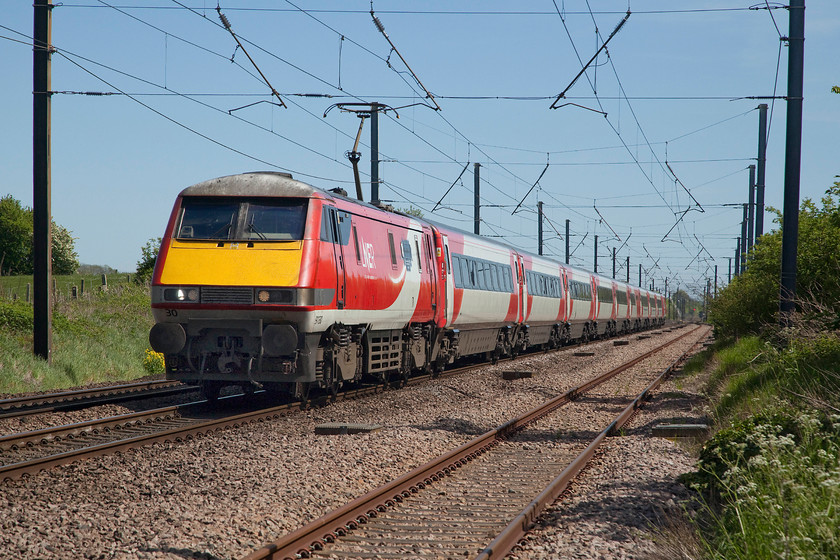 91130, GR 13.33 London King`s Cross-Leeds (1D16, 2L), Barnby Lane SK850495 
 A very smart looking 91130 'Lord Mayor of Newcastle' leads the 13.33 King's Cross to Leeds 1D16 service past Barnby Lane level crossing in the village of Claypole. When these very capable class 91s are withdrawn from this route by the early spring of next year, there will be an almost complete dearth of locomotive-hauled trains on the UK network as the class 90s will also be on the way out from the Great Eastern mainline. Ironic that TransPennine Express are actually introducing a few class 68 services with the new CAF built Mk. V stock; it's strange how things come around! 
 Keywords: 91130 13.33 London King`s Cross-Leeds 1D16 Barnby Lane SK850495