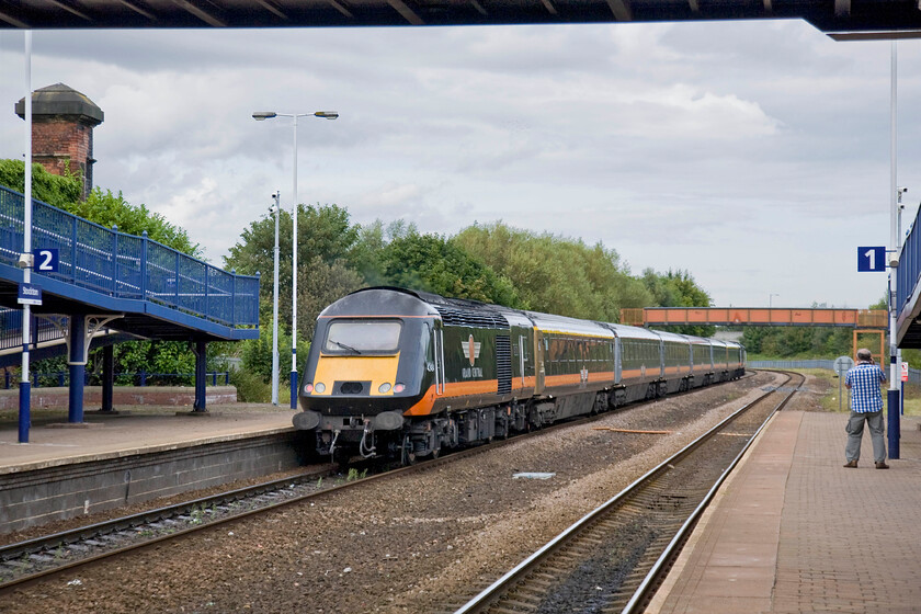 43484, GC 12.53 London King's Cross-Sunderland (1N93), Stockton-on-Tees station 
 Andy secures his photograph of Grand Centrals 12.53 Kings Cross to Sunderland service as it passes through Stockton-on-Tees station. At the rear is buffer beam fitted HST power car 43484. I must admit that we were a little disappointed with Stockton-on-Tees station given its significance and pivotal role in the early developments of the railways. 
 Keywords: 43484 12.53 London King's Cross-Sunderland 1N93 Stockton-on-Tees station Grand Central HST