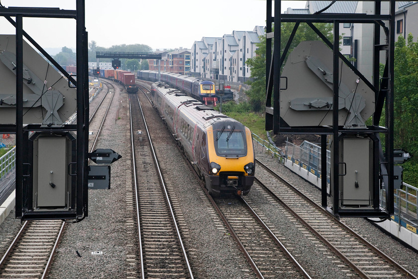 220032, XC 09.47 Bournmouth-Leamington Spa (1M38, 1L) & 43159, stabled, Oxford Carriage Sidings, Walton Well Bridge 
 Framed by two of Oxford North's giant new multiple aspect signals 222032 leaves the city forming the 09.47 Bournemouth to Leamington Spa. I don't know what it is about the size of the new structures that are being erected but some of the infrastructure does seem to be excessively big with some very 'hard engineering' being utilised. 
 Keywords: 220032 1M38 43159 Oxford Carriage Sidings Walton Well Bridge