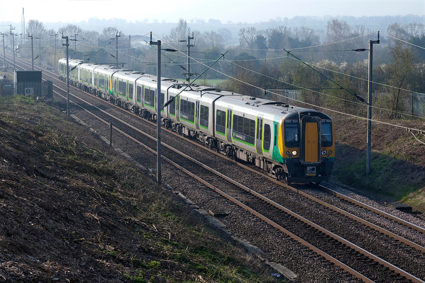 350104 & 350121, LN 07.05 London Euston-Birmingham New Street (2Y07, 2L), Milton Malsor SP738560 
 Another view now on offer to the photographer is this one looking south at Milton Malsor on the Northampton loop line. Thanks to Network Rail's efforts to clear the lineside of years of uncontrolled vegetation growth, 350104 and 350121 can be clearly seen working the 07.05 Euston to Birmingham New Street. 
 Keywords: 350104 350121 07.05 London Euston-Birmingham New Street 2Y07 Milton Malsor SP738560