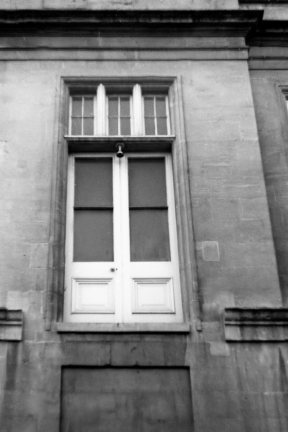 Doors for access over footbridge (removed 1946) to Royal Hotel, Bath Spa station 
 An anonymous pair of doors on the first floor of Bath Spa station appear to go nowhere! They used to give access to a bridge that crossed the station forecourt straight into the Royal Hotel that is behind me. This bridge, that was removed in 1946, reminds us of a time when the railways and accommodation were far more closely associated than today. 
 Keywords: Doors for access over footbridge Royal Hotel Bath Spa station