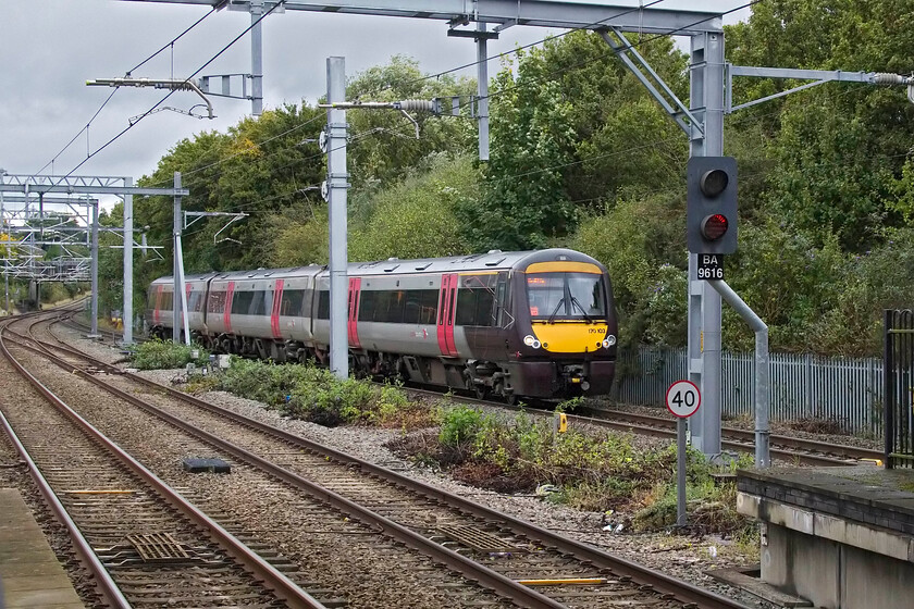 170103, XC 14.07 Nottingham-Cardiff Central (1V11, 1L), Bromsgrove station 
 Having just descended Lickey Incline, the first part of which can be seen in the background, 170103 is seen passing Bromsgrove working the 14.07 Nottingham Cardiff service. The small 1969-built station (then a single platform) that was later given a second platform was located. just beyond the rear of the train just before the over bridge. This was closed in 2016 when the new and much grander four-platform affair was opened along with the electrification of this route. 
 Keywords: 170103 14.07 Nottingham-Cardiff Central 1V11 Bromsgrove station Cross Country Turbo