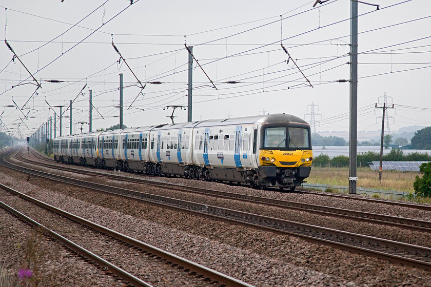 365537 & 365516, GN 10.46 Peterborough-London Kings Cross (1P59, 6L), Sandy TL176510 
 365537 and 365516 take the first curve after a four mile stretch of dead straight line working the 10.46 Peterborough to King's Cross. In the background the huge new Waterloo solar wind farm can be seen. It is so big that it is even named on the Ordnance Survey map! 
 Keywords: 365537 365516 1P59 Sandy TL176510