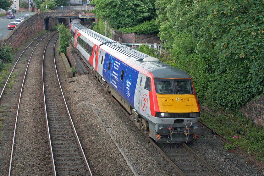 82226 AW 16.36 Holyhead-Cardiff Central (1V98, RT), Bonewaldesthorne's Tower Chester city wall 
 Having entered Chester a little earlier with 67010 at the helm, the 16.36 Holyhead to Cardiff TfW service is now partially retracing its steps with former LNER DVT 82226 now leading with the Bo-Bo pushing at the rear. A short distance from here at Roodee Junction the train will head off to the south and continue its journey along the Welsh Border. This is the first time that I have seen a former ECML DVT away from their 'natural' home, the last time that I saw this one was in Bedfordshire back in 2017, see.... https://www.ontheupfast.com/p/21936chg/24908401204/x82226-91103-1y11-arlesey-tl189364 
 Keywords: 82226 16.36 Holyhead-Cardiff Central 1V98 Bonewaldesthorne's Tower Chester city wall Transport for Wales DVT