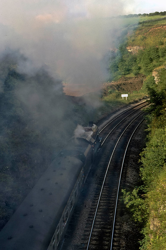 5690, return leg of The Cumbrian Coast Express, 16.45 Sellafield-Blackpool North, Lindal Bank SD240747 
 The going-away photograph of 5690 'Leander' thrashing up Lindal bank is better than the previous facing one, marginally! 5690 is leading the returning 16.45 Sellafiled to Carnforth and Blackpool North railtour. The white sign indicates that the train is just about to enter the twenty-two chain (a quarter of a mile) Lindal tunnel that is just out of sight around the corner. 
 Keywords: 5690 The Cumbrian Coast Express 16.45 Sellafield-Blackpool North Lindal Bank SD240747