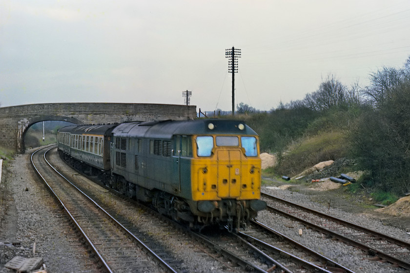 31233, unidentified Bristol Temple Meads-Weymouth working, from Fairwood Junction signal box 
 31233 was a cop when I saw it from Fairwood Junction signal box as it was a Eastern Region locomotive. It was also a long-lived member of the class as it became one of Network Rail's dedicated all yellow test train locomotives only recently being retired and finding a new home in the preservation world. I am not sure how my friend Guy and I bagged a visit into Fairwood Junction signal box. It may have been that the signallman Mervin Holbrook was on-duty, and, as he lived a few houses away from me and, knowing that I was a budding enthusiast, he may have given me the nod! 
 Keywords: 31233 Bristol Temple Meads-Weymouth working from Fairwood Junction signal box