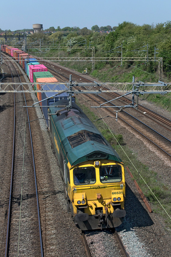 66531, 12.16 Lawley Street-London Gateway (4L46, 27E), Victoria bridge 
 Running on the up fast 66531 leads the 4L46 12.16 Lawley Street to London Gateway Freightliner past Victoria bridge just south of Roade. After a slightly hazy start to the day with the sun burning through some high cloud, it turned into a stunning day with brilliant sunshine. 
 Keywords: 66531 12.16 Lawley Street-London Gateway 4L46 Victoria bridge Freightliner