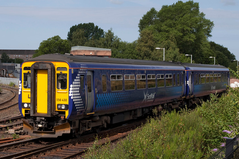 156430, SR 09.43 Glasgow Central-Kilmarnock (1A16, RT), Kilmarnock North Junction 
 Scotrail 156430 approaches the end of its journey working the 09.43 from Glasgow Central. It is crossing Kilmarnock North Junction with the roof of the signal box just visible above the roof of the unit. The photograph is taken from a newly created spot just south of the station from the grounds of the newly opened Ayrshire College. 
 Keywords: 156430 1A16 Kilmarnock North Junction