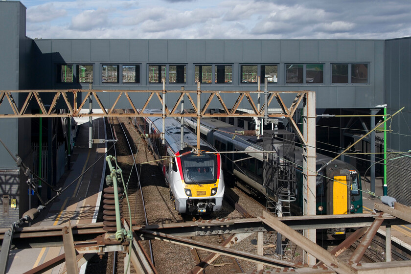 720137, 13.20 Rugby-Wembley Yard (5Q35, 5E) & 350244, LN 12.36 Birmingham New Street-London Euston (1Y40, 2L), Northampton station 
 On arrival at Rugby on our return journey, our train passed the 13.20 Rugby to Wembley Yard mileage accumulation/staff training run as it was waiting to leave. Thus, it followed our train to Northampton a short distance behind. On arrival at Northampton, as I walked to collect the car, 720137 passed through the centre road as the 5Q35 seen from St. James Road. 
 Keywords: 720137 13.20 Rugby-Wembley Yard 5Q35 350244 12.36 Birmingham New Street-London Euston 1Y40 Northampton station Greater Anglia