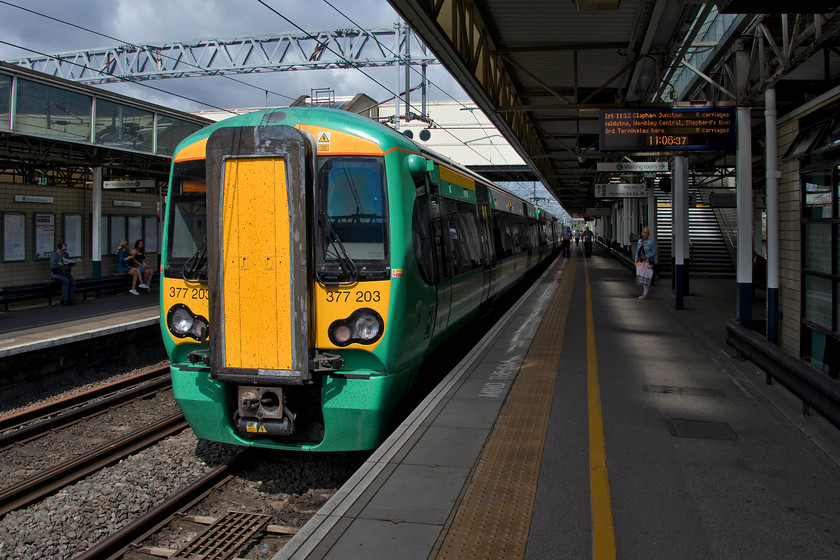 377203, SN 11.12 Milton Keynes Central-Clapham Junction (2O33, RT), Milton Keynes station 
 A sunny start to our trip at Milton Keynes station. Our train to London was Southern's 11.12 to Clapham Junction that we took as far as Kensington Olympia. 377203 took us as far as Kensington Olympia where we then took two buses to Richmond. In retrospect, it would have been better to take the Southern service to Clapham Junction and touch-in on our Oyster cards for the short journey by train to Richmond. I like these 377s, they are roomy and comfortable the only issues is the time taken between North Pole and Shepherd's Bush for the change over to AC to Dc operation that involves a complete stop and shut down of systems. 
 Keywords: 377203 11.12 Milton Keynes Central-Clapham Junction 2O33 Milton Keynes station