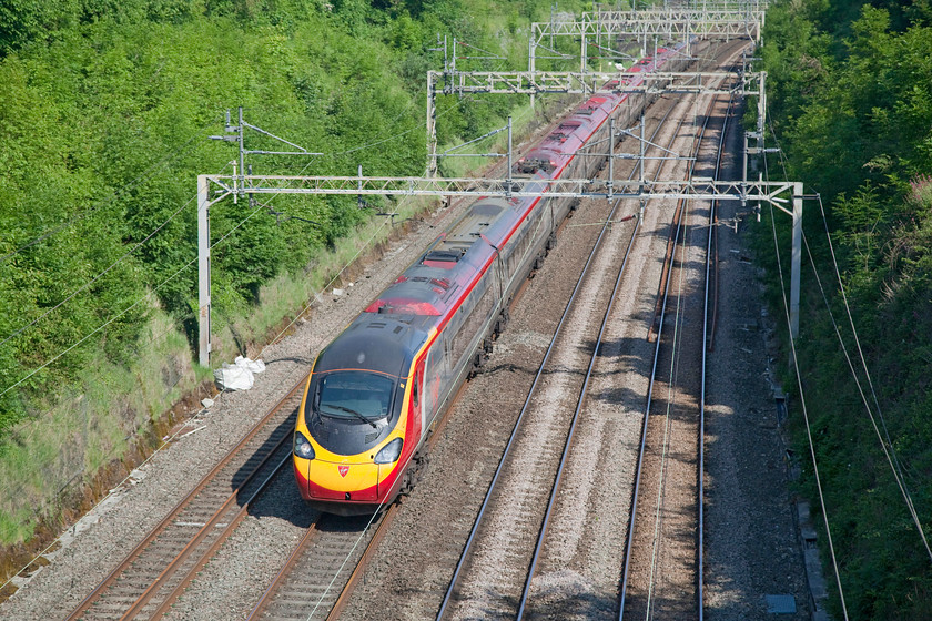 Class 390, VT 07.55 Manchester Piccadilly-London Euston (1R28), Hyde Road Bridge 
 A Class 390 makes its way through Roade Cutting in the summer sunshine. It is forming the 07.55 Manchester Piccadilly to London Euston. 
 Keywords: Class 390 07.55 Manchester Piccadilly-London Euston 1R28 Hyde Road Bridge