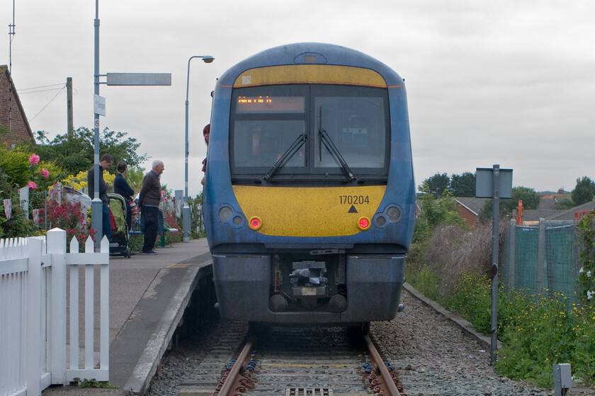 170204, LE 10.46 Sheringham-Norwich, Sheringham station 
 Still wearing its defunct One livery 170204 passengers wait to board the 10.46 service to Norwich at Sheringham station. 
 Keywords: 170204 10.46 Sheringham-Norwich Sheringham station Greater Anglia National Express East Anglia