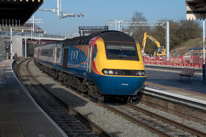 43058, EM 11.45 Nottingham-London St. Pancras (1B38, 11L), Wellingborough station 
 HST power car 43058 leads the 11.45 Nottingham to St. Pancras service through Wellingborough station on this crisp winter's day. This power car is now in its final weeks of operation having been introduced during 1977 on the Eastern Region as part of set 254002. It is about to be withdrawn as the stock is operating under special dispensation since 01.01.20 due to it not meeting the persons with reduced mobility legislation. Some of the former ECML LNER HSTs are currently being modified in order to comply with the legislation and are to be introduced soon but the process is running late - of course! 
 Keywords: 43058 11.45 Nottingham-London St. Pancras 1B38 Wellingborough station HST East Midlands Railway EMR