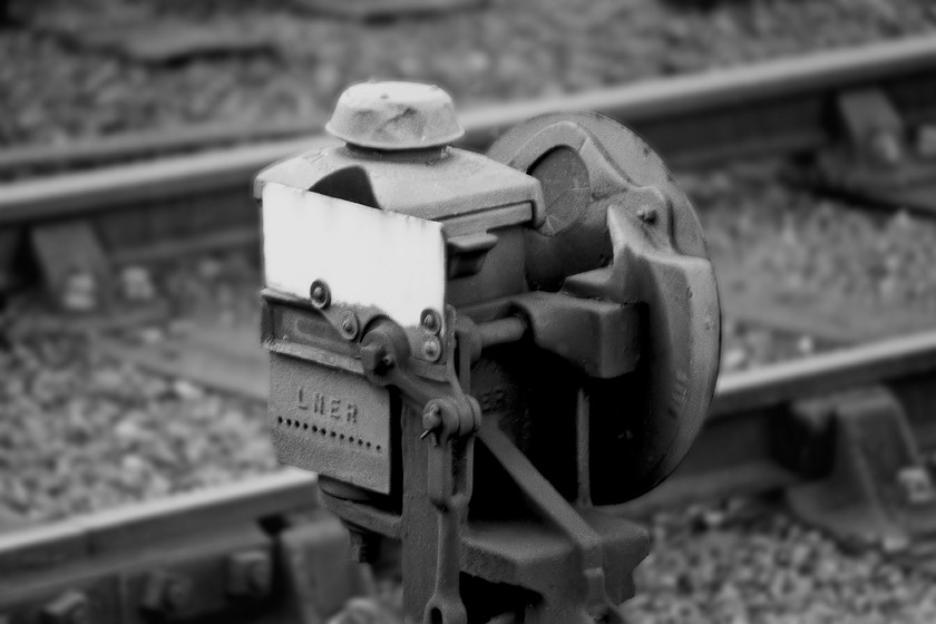 LNER lamp and ground signal, Whitby station 
 A ground signal in Whitby station located just in front of the rather grand signal box close to the platform end. Of particular interest is the LNER oil lamp inserted into the signal. 
 Keywords: LNER lamp and ground signal Whitby station