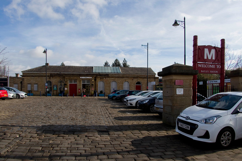 Frontage, Batley station 
 The frontage of Batley station. It was opened by the London and North Western Railway in 1848. It was once a rather larger and more important affair being at the junction of to other cross-Yorkshire lines that fell victim, as did so many, to the Beeching axe. 
 Keywords: Batley station