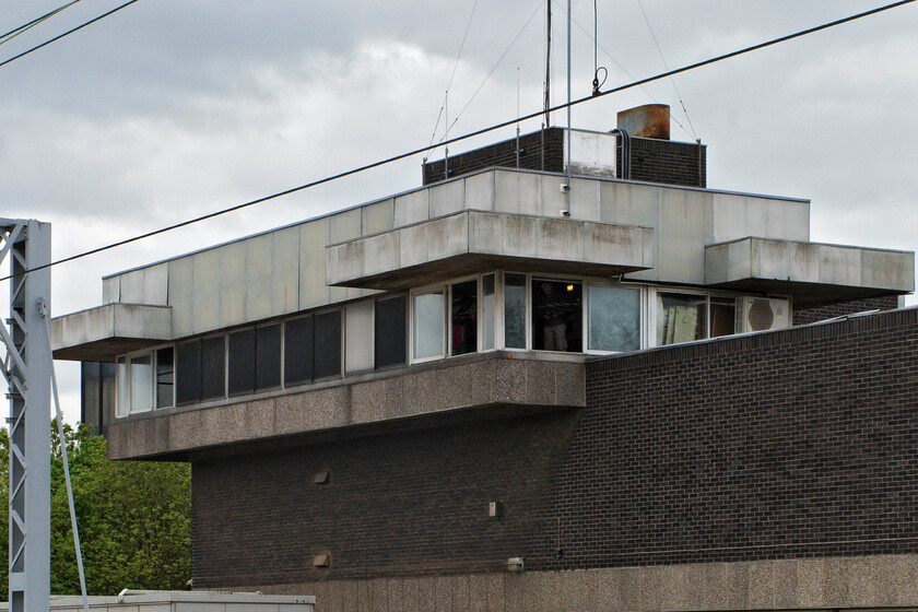 Bletchley PSB (BR, 1965) 
 Brutalist but functional concrete structures at their very best! The large Bletchley signal box is seen from the station's platform end. With the windows slung open, all looks normal but for the fact it had closed on 31.12.12 but was yet to be de-commissioned. It was open on this day for visits from the public with monies raised going to charity. Andy and I enjoyed our informative visit to the box but its future now is uncetain. 
 Keywords: Bletchley PSB BR 1965