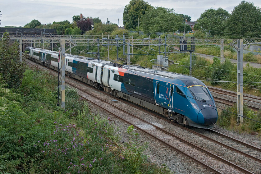 805003, 12.07 Preston-London Euston (3A92, 37L), site of Roade station 
 Making yet another empty stock run prior to it entering service, Evero 805003 passes Roade as the 3A92 12.07 Preston to Euston. I am surprised at the relatively slow rate at which the Everos are entering service with Voyagers still seen (and heard!) passing Roade throughout the day. 
 Keywords: 805003 12.07 Preston-London Euston 3A92 site of Roade station AWC Avanti West Coast Evero