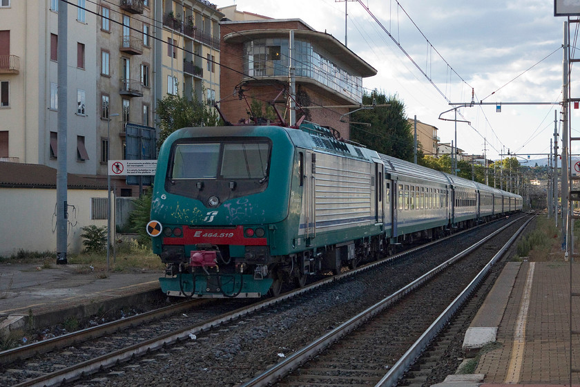 464.519, 17.08 Arezzo-Florence SMN (3166), Florence CM station 
 A rather tatty 464.519 propels the 17.08 Arezzo to Florence SNM service out of Florence CM station. It is passing the former signal box (or control tower as the Italians prefer to call it) that is now a private house. What a view of the line, I hope the owner is a railway enthusiast! 
 Keywords: 464.519 17.08 Arezzo-Florence SMN 3166 Florence CM station