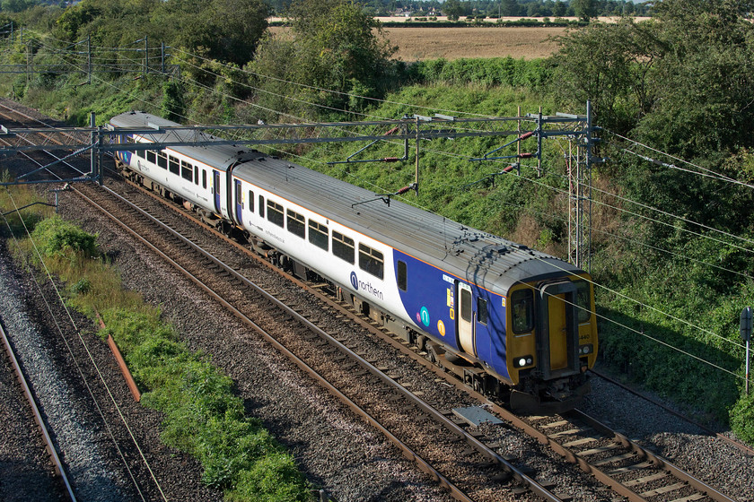 156440, 14.49 Newton Heath-Wolverton centre sidings (5H70, 3E), Victoria bridge 
 A Northern interloper makes its way up the WCML passing just south of Roade in Northamptonshire. 156440 is making the 14.49 journey from its base at Newton Heath (Greater Manchester) to Wolverton for attention at the works. I know that it's only a diesel unit but we do not get many of these in this area and their life expectancy is now pretty short so they are always worth a photograph. 
 Keywords: 156440 14.49 Newton Heath-Wolverton centre sidings 5H70 Victoria bridge Northern Sprinter