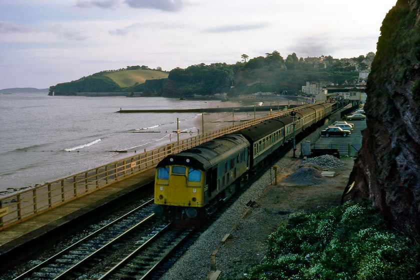 25225, 17.50 Paignton-Exeter St. David's, Dawlish station 
 Over the years various motive power was employed in and around Exeter working its local services augmented with by some first-generation DMUs. Class 25s were regular performers and always provided a bit of variety trundling along the sea wall. Unfortunately, 25225 is in the evening shade as it leaves Dawlish leading the 17.50 Paignton to Exeter St. David's service. Some years later, these trains were replaced by wholly inadequate Skippers as they were dubbed in the West Country. 
 Keywords: 25225 17.50 Paignton-Exeter St. David's Dawlish station