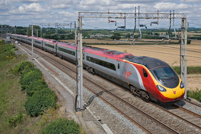 390123, VT 10.00 Preston-London Euston (1A10), Blisworth 
 390123 is just over half an hour of its destination (as long as things go with no incident) as it passes near the Northamptonshire village of Blisworth with the 10.00 Preston to Euston Virgin service. 
 Keywords: 390123 10.00 Preston-London Euston 1A10 Blisworth .jpg