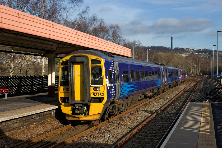 158782 & 153328, NT 13.20 Manchester Victoria-Leeds (1U06, 1L), Sowerby Bridge station 
 158782 and 153328 leaves Sowerby Bridge station with the 13.20 Manchester Victoria to Leeds service. The station canopies date from 1981 when the station was completely re-built by BR following a disastrous fire that destroyed the 1840 Manchester and Leeds Railway buildings. 
 Keywords: 158782 153328 13.20 Manchester Victoria-Leeds 1U06 Sowerby Bridge station