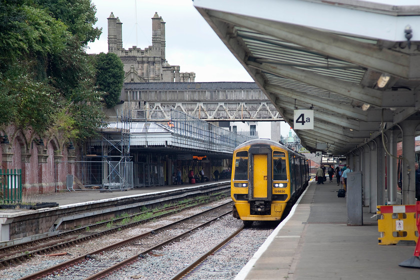 158830, AW 09.30 Aberystwyth & 07.24 Pwllheli-Birmingham International (1G25 & 2G25), Shrewsbury station 
 Having arrived at Shrewsbury, 158830 has a generous dwell time at platform four. This allows the crew to change ends and prepare the train to work back out again towards the Midlands. The 158 is forming, with another unit on the rear, the 09.30 Aberystwyth and 07.24 Pwllheli to Birmingham International. The two units came together at Machynlleth to work forward. 
 Keywords: 158830 09.30 Aberystwyth 07.24 Pwllheli-Birmingham International 1G25 2G25 Shrewsbury station