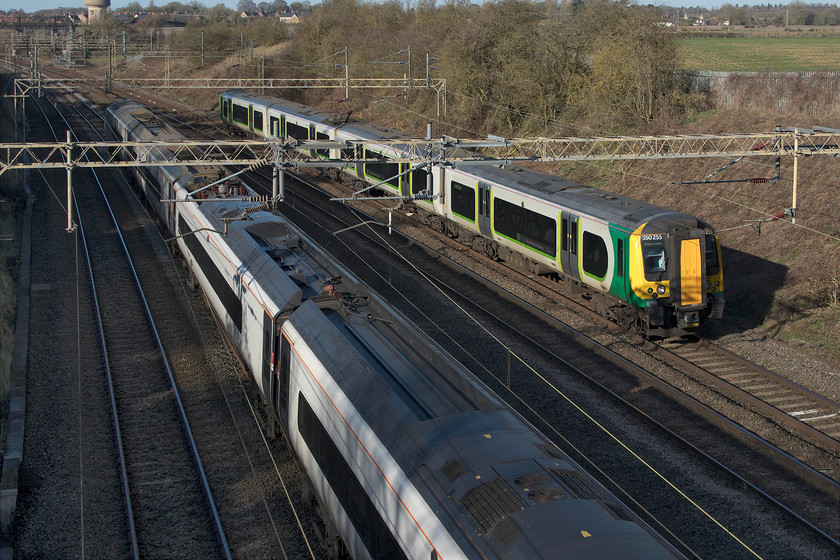 390122, VT 11.47 Liverpool Lime Street-London Euston (1A30, 3L) & 350255, LN 11.20 Rugeley Trent Valley-London Euston (1Y22, 3L), Victoria bridge 
 As 390122 'Penny the Pendolino' heads south with the 11.47 Liverpool to Euston service 350255 is passing on the slow line working the 11.20 Rugely Trent Valley Euston train that has gone via Birmingham with a reversal at New Street. The trains pass at Victoria bridge between Northampton and Milton Keynes. 
 Keywords: 390122 11.47 Liverpool Lime Street-London Euston 1A30 350255 11.20 Rugeley Trent Valley-London Euston 1Y22 Victoria bridge Pendolino Desiro Avanti West Coast London North Western