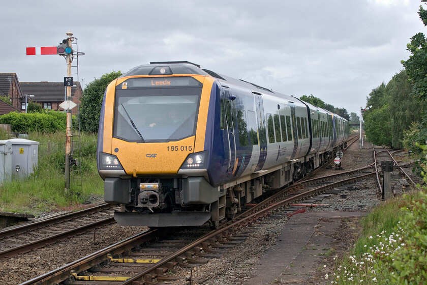 195015 & 195014, NT 09.22 Chester-Leeds (1E56, RT), Helsby station 
 The 1E56 09.22 Chester to Leeds Northern service rattles over the pointwork to the immediate southwest of Helsby station. Consecutively numbered Civitys 195015 and 195014 are working the service, the same two that were seen a little earlier heading in the opposite direction. Notice the sidings to the right of the train. I am not at all sure as to why they have been retained, perhaps some local knowledge can enlighten me? However, whatever their purpose they have not seen any use for a long time and I suspect that they are ripe for disconnection and removal. 
 Keywords: 195015 195014 09.22 Chester-Leeds 1E56 Helsby station Northern Civity