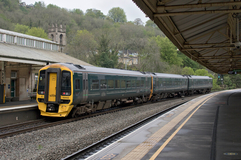 158950, GW 14.02 Warminster-Cardiff Central (1F68, RT), Bath Spa station 
 What appears to be some sort of hybrid unit leaves Bath Spa station working the 14.02 Warminster to Cardiff 1F68 service. At the rear of the train is one car from three-car set 158950 whilst an unidentified two-car unit from the 158/0 sub set leads the service. 
 Keywords: 158950 14.02 Warminster-Cardiff Central 1F68 Bath Spa station