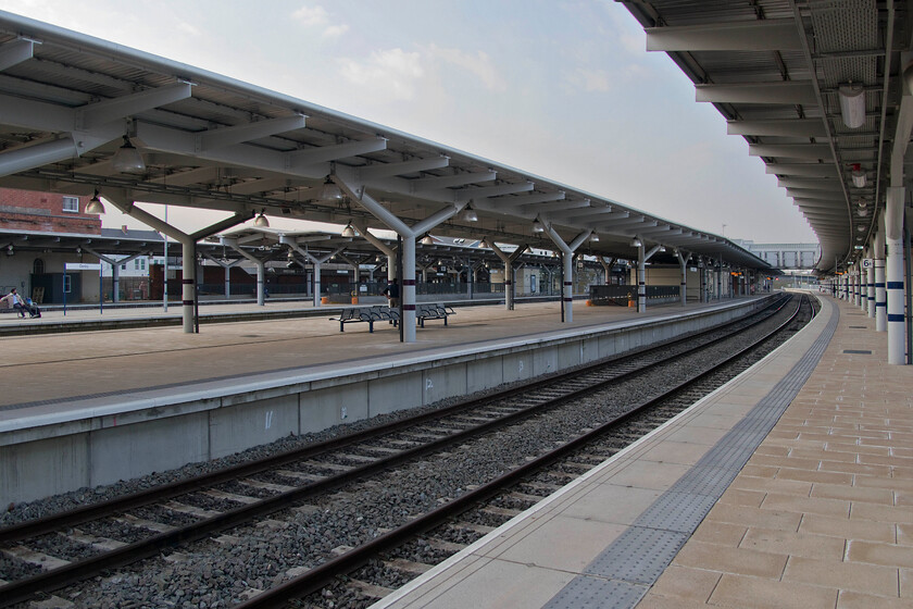 Derby station 
 Think about this.......it's just before 17.00 on a Wednesday afternoon and this is the scene at Derby station; where is everybody? Close examination of the photograph reveals just two people with it appearing more like a 'where's Whally' scene than a busy interchange station! This is what two years of COVID has done to the railways and I have to ask if things will return to pre-pandemic conditions? My feeling is that the railways will have to recognise this and realise that the peak is now the leisure market rather than to commuter. However, the railways are notoriously slow at changing their mindset with the undertaking of engineering work at weekends and public holidays being a great example of something that can now and needs to change. 
 Keywords: Derby station