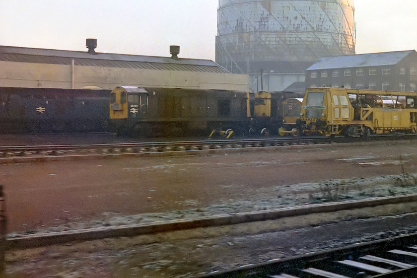 Class 37, 20197 & class 20, stabled, Gloucester Horton Road 
 Taken as our train entered Gloucester station, a class 37 and 2 class 20s are seen stabled on Horton Road depot. 20197 in the centre is still in its green livery. It survived into the privatisation era becoming a Harry Needle owned locomotive. It was eventually withdrawn and cut up at EMR Kingsbury in 2011. 
 Keywords: 20197 green Gloucester Horton Road