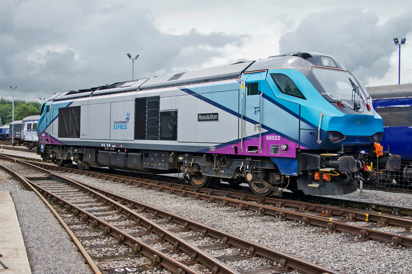 68022, on-display, DRS open day, Kingmoor 
 I think that the livery that TransPennine Express has applied to the class 68s is a bit fussy with too many wooshes and stripes! The problem is exacerbated by the lack of a yellow front end as the lighting arrangements negate a need for it. 68022 'Resolution' awaits its turn to work for TPE as there are, surprise-surprise, huge delays with the introduction of the CAf Mk. IV stock. The name 'Resolution' was also carried by 50018 from April 1978 until its withdrawal in July 1991, a locomotive that I photographed a number of times. 
 Keywords: 68022 on-display DRS open day Kingmoor