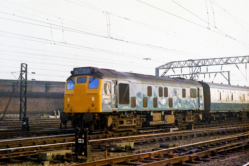 25047, unidentified Cardiff Central-Crewe working, Crewe station 
 25047 chunters into Crewe station with an unidentified working that had originated in Cardiff. The train had wandered up the Welsh Border all the way to Shrewsbury and then up to Crewe. 25047 looks smart in this picture with its headcode panel yet to have the domino makers installed. It had another three years in service being withdrawn in September 1980 going to Swindon to be broken up. 
 Keywords: 25047 Crewe Cardiff