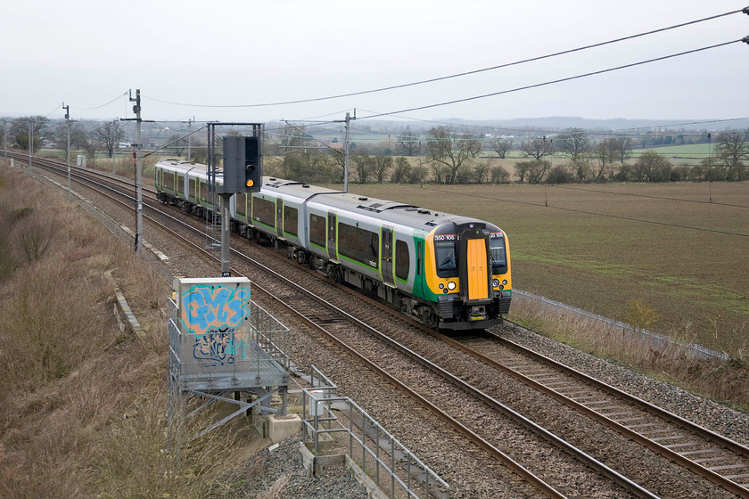 350105, LM 10.37 Crewe-London Euston (1U28), Milton crossing 
 This photograph was taken just two hours after.... https://www.ontheupfast.com/p/21936chg/29864500404/x350114-london-midland-desiro-09 and just look at how the weather has changed! With the weather now having reverted to type in the form of winter grey gloom 350105 works the 1U28 10.37 Crewe to Euston past Milton Crossing on the Weedon line between Roade and Blisworth. 
 Keywords: 350105 LM 10.37 Crewe-London Euston 1U28 Milton crossing Weedon loop London Midland Desiro