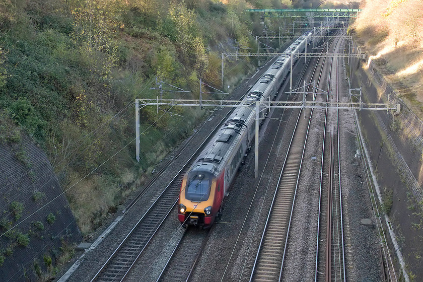 Class 221s, VT 11.50 Holyhead-London Euston (1A35, 1E), Roade Cutting 
 A pair of class 221s race through Roade Cutting working the 11.50 Holyhead to Euston. A ten-car 221 is composed of a pair of units joined together that needs double manning; not the most efficient way to run a train service! 
 Keywords: Class 221 VT 11.50 Holyhead-London Euston 1A35 Roade Cutting