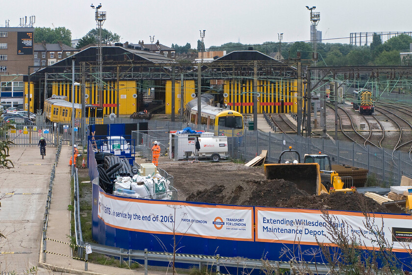 Willesden Depot 
 Taken from Willesden Junction (High Level) station the work underway to expand the adjacent depot appears well underway. With new stock due to arrive that has longer formations greater capacity is required at the North London depot. 
 Keywords: Willesden Depot