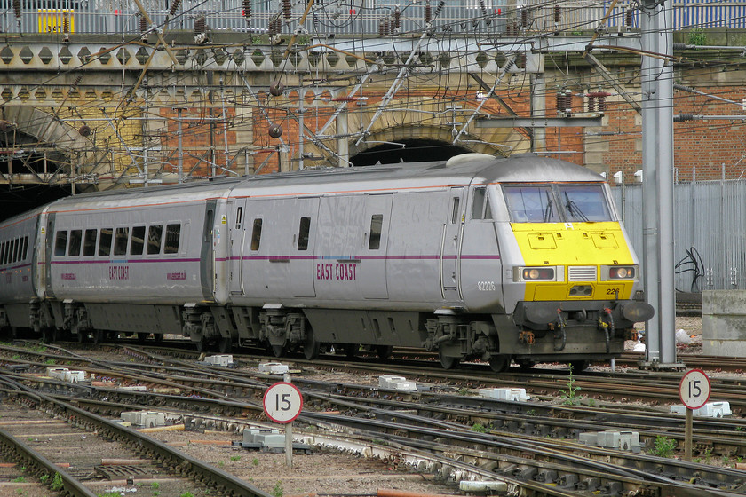 82226, GR 10.15 Leeds-London King`s Cross (1A22), London King`s Cross station 
 82226 is about to disappear into the darkness of Gasworks Tunnel as it leaves King's Cross at the rear of the 10.15 to Leeds. With the chronic over-crowding of King's Cross, there are discussions to re-open the disused tunnel that can be seen behind the DVT. It is currently used as access and as a route for much electrical cabling. The King's Cross power signal box partially blocks the portal so that issue will need consideration before any re-opening can take place. 
 Keywords: 82226 10.15 Leeds-London King`s Cross 1A22 London King`s Cross station