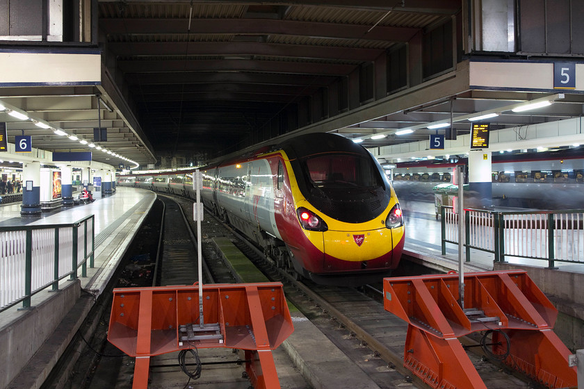 390121, VT 19.30 London Euston-Glasgow Central (1S06, RT), London Euston station 
 390121 'Virgin Dream' sits at the blocks of Euston station's platform five waiting to head north to work the 19.30 to Glasgow Central. This is the last of the Anglo-Scottish express' of the day and that arrives into Central station at just after midnight. 
 Keywords: 390121 19.30 London Euston-Glasgow Central 1S06 London Euston station