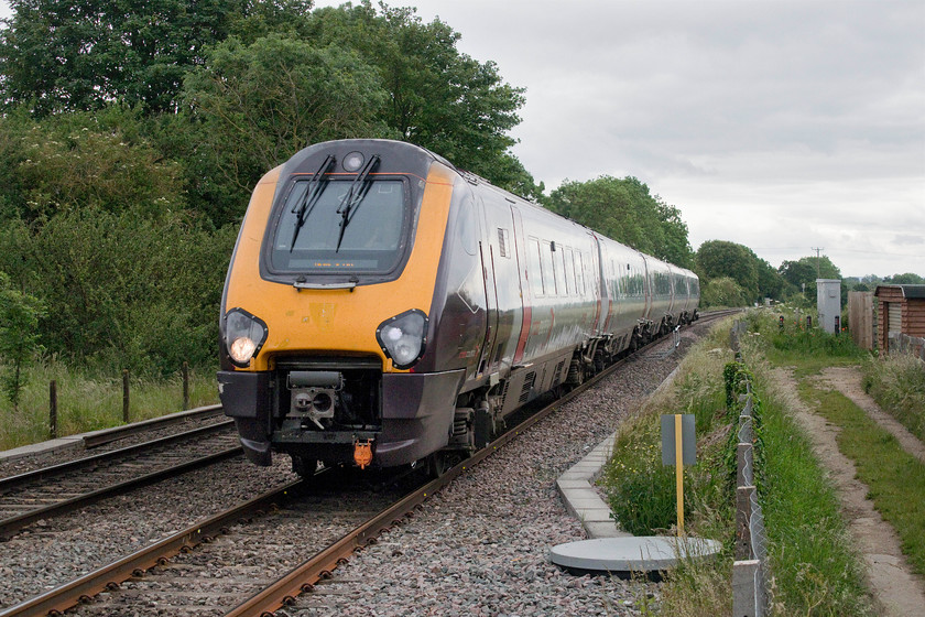 221129, XC 09.45 Reading-Newcastle (1E32, 4L), Tackley station 
 221129 approaches Tackley station, that is just behind where I am standing, forming the 09.45 Reading to Newcastle service. Despite appearances, I am in a safe position standing the right side of the fence, at a user-operated crossing that leads to the Oxford Canal. 
 Keywords: 221129 09.45 Reading-Newcastle 1E32 Tackley station