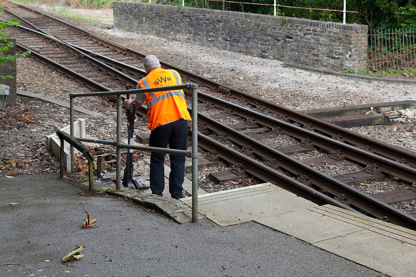 Changing the points for the 09.29 Gunnislake-Plymouth (2P83, 1E), Bere Alston station 
 Having come to a halt at Bere Alston station, the guard of the 09.29 Gunnislake to Plymouth working walks from the train to change the points. This will then allow the class 150 to reverse and take the line to the left and continue its journey to Plymouth. 
 Keywords: Changing the points for the 2P83 Bere Alston station