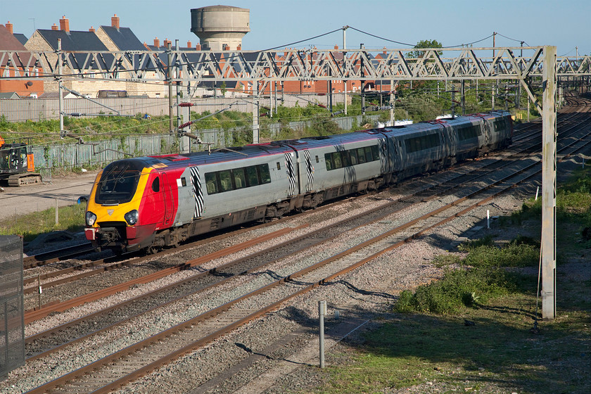 221103, VT 17.28 London Euston-Wolverhampton (9G12, 4L), site of Roade station 
 Approaching the end of the third week of the closure of the fast lines between Hanslope and Hillmorton Junctions means that all services are still travelling via Northampton. 221103 still wearing its Virgin colours passes Roade working the 9G12 17.28 Euston to Wolverhampton service. With plenty of capacity due to the reduced COVID timetable quite why Avanti are using their Voyagers on turns such as this is beyond me. Surely it must be more costly than running a Pendolino and far less environmentally agreeable or am I missing something? 
 Keywords: 221103, VT 17.28 London Euston-Wolverhampton 9G12 site of Roade station Virgin Voyager Avanti West Coast