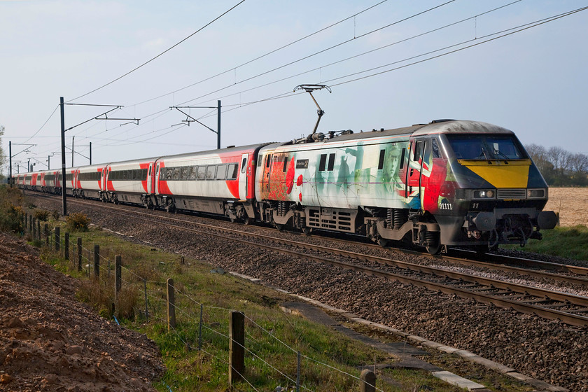 91111, GR 09.00 London King`s Cross-Edinburgh (1S09, 2L), Cromwell Lane crossing SK792616 
 In its one-off and very distinctive livery, 91111 'For the fallen' passes Cromwell level crossing with the 09.00 King's Cross to Edinburgh express. I am standing on some large piles of spoil that had been in-filled by the landowner that had give some height at this spot that improved the perspective considerably. 
 Keywords: 91111 09.00 London King`s Cross-Edinburgh 1S09 Cromwell Lane crossing SK792616