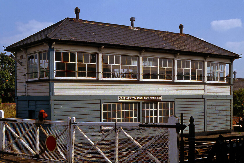 Croesnewyedd North Fork signal box (GW, c. 1906) 
 If there was ever a prize for the signal box with the longest name this could well win it! Croesnewyedd North Fork signal box or Croes Newydd North Fork, to give its alternative name, is a fine and substantial Type 27c GWR box opened around 1906. It is still extant at the time of writing in 2022 but has lost a lot of its classic looks due to plastification, the control of the wooden crossing gates and all of the semaphores having had a Unipart entrance-exit signalling panel in 2009. The road that crosses the line here is named Watery Road and is a particularly busy place for a level crossing as it leads to the huge Wrexham Maelor hospital 
 Keywords: Croesnewyedd North Fork signal box GWR Great Western Railway