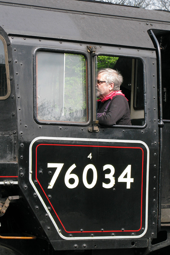 Driver & 76034 (76084), 13.30 Sheringham-Holt, The North Nolfolkman Dining Train, Sheringham station 
 The driver of 76084 (masquerading as 76034) waits to get his train away from Sheringham station. The Class 4MT is leading the line's premier train The North Norfolkman Dining Train that leaves Sheringham at 13.30. It makes two runs to Holt and back giving the passengers that chance to enjoy a three-course meal and enjoying steam haulage along this delightful heritage line. 
 Keywords: 76034 13.30 Sheringham-Holt The North Nolfolkman Dining Train, Sheringham station NNR North Norfolk Railway Poppy Line British Railways Standard Class 4MT 76084