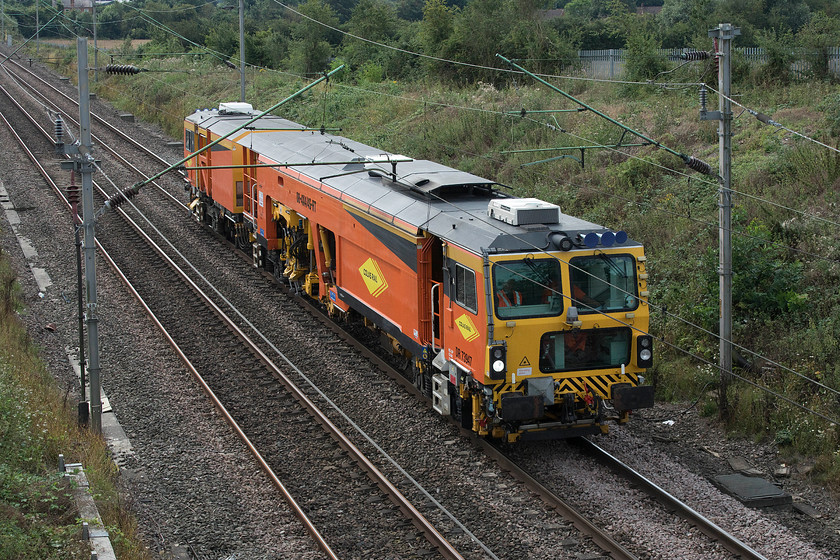 DR73947, 11.15 Hanslope Junction-Rugby Depot (via reversal at MKC) , Milton Malsor SP738560 
 Having completed some engineering work over the previous night, track machine DR73947 heads back to Rugby as the 11.15 ex Hanslope Junction via a reversal at Milton Keynes. The Colas Rail operated machine is seen passing Milton Malsor on the approach to Northampton. 
 Keywords: DR73947 11.15 Hanslope Junction-Rugby Depot Milton Malsor SP738560