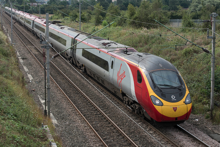 390156, VT 10.16 London Euston-Liverpool Lime Street (1F12, 5L), Milton Malsor SP738560 
 390156 'Stockport 170' is seen passing Milton Malsor on the approach to Northampton with the 10.16 Euston to Liverpool 1F12 service. It is taking the slower route rather than the mainline due to an engineering possession. This Pendolino was the first eleven-car set to be introduced to service during February 2012 
 Keywords: 390156 10.16 London Euston-Liverpool Lime Street 1F12 Milton Malsor SP738560